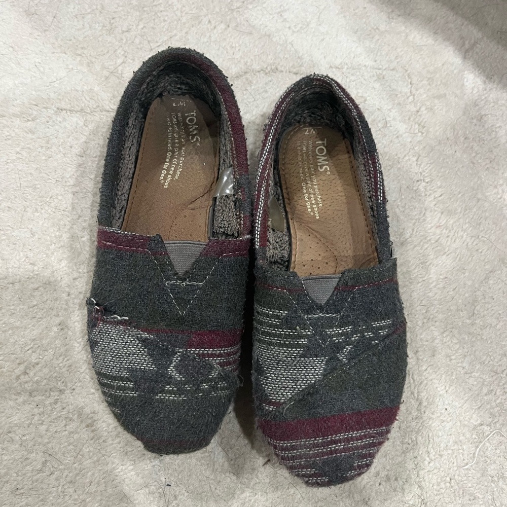 Dark grey slip on Tom’s shoes